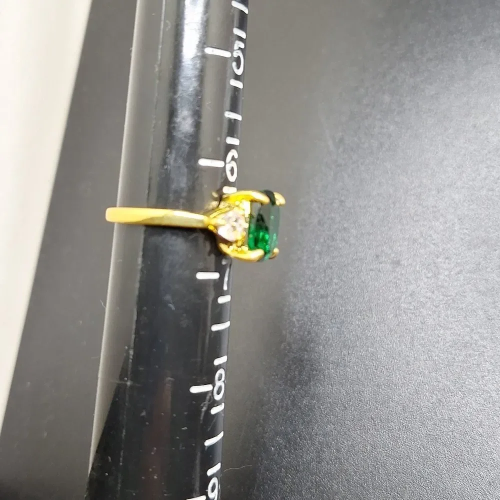 EMERALD cut green stone engagement ring
